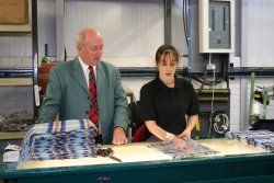 David with weaver Carol Preston during the manufacturing process.